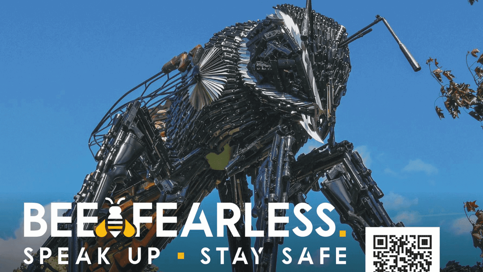 Robotic sculpture of a dog made from metal parts on a blue sky background, promoting awareness and safety campaigns.
